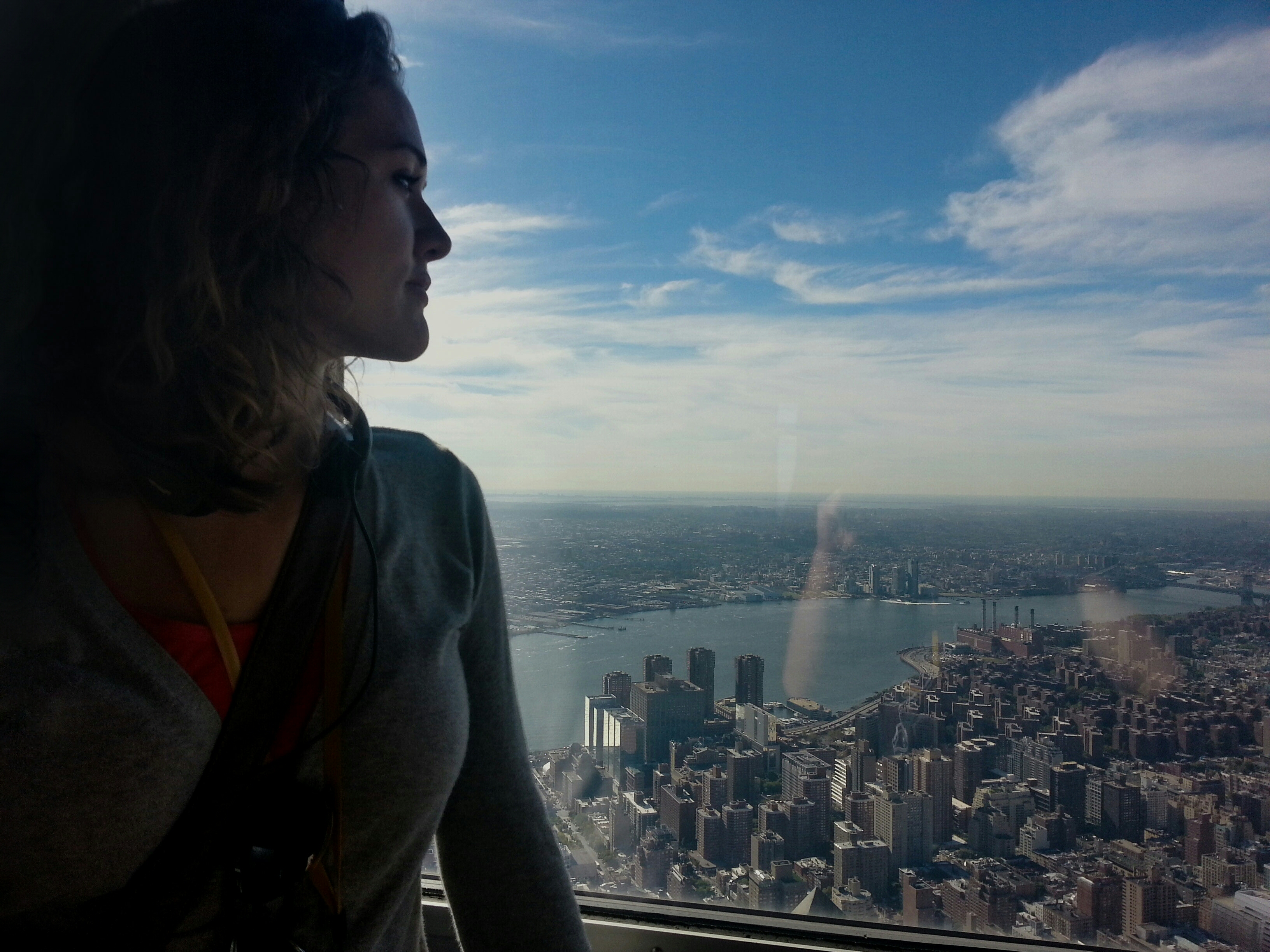 Brooke looking out the window of the 102nd floor